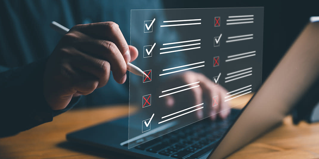 checklist for marketing with a person holding pen